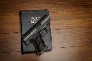 a gun and bible